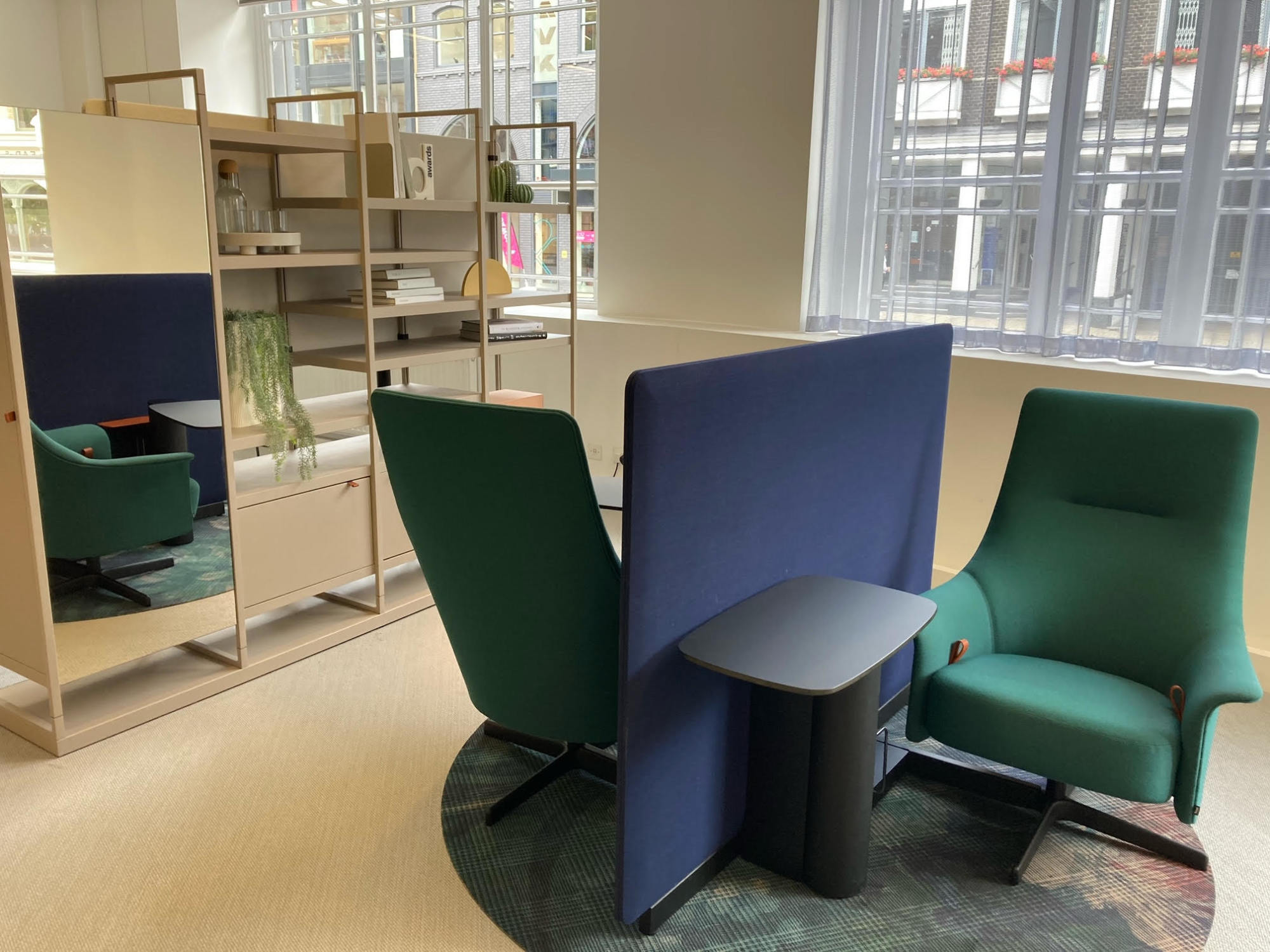 A Bene office furniture concept showing two chairs within an office space