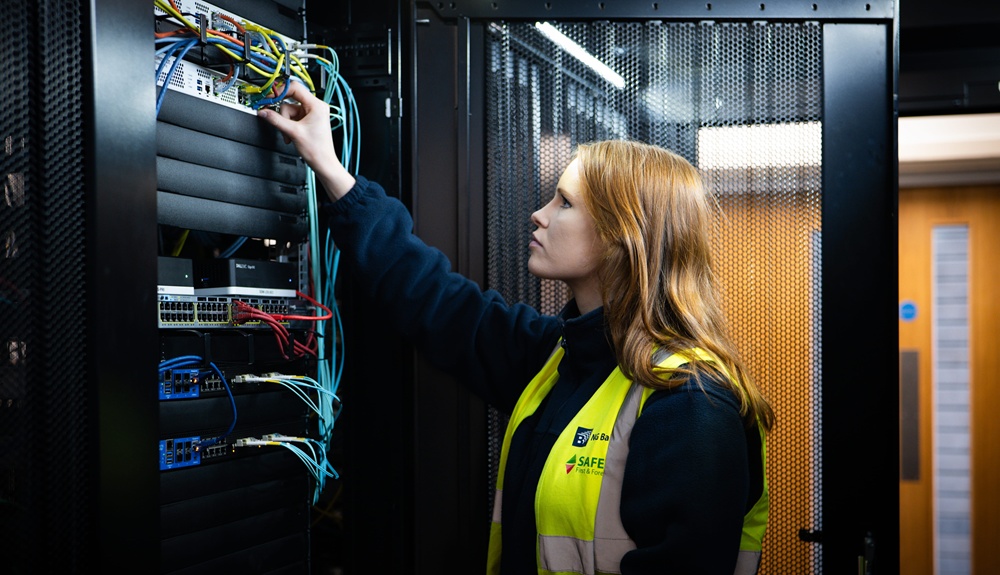 An image of an apprentice working at a server stack