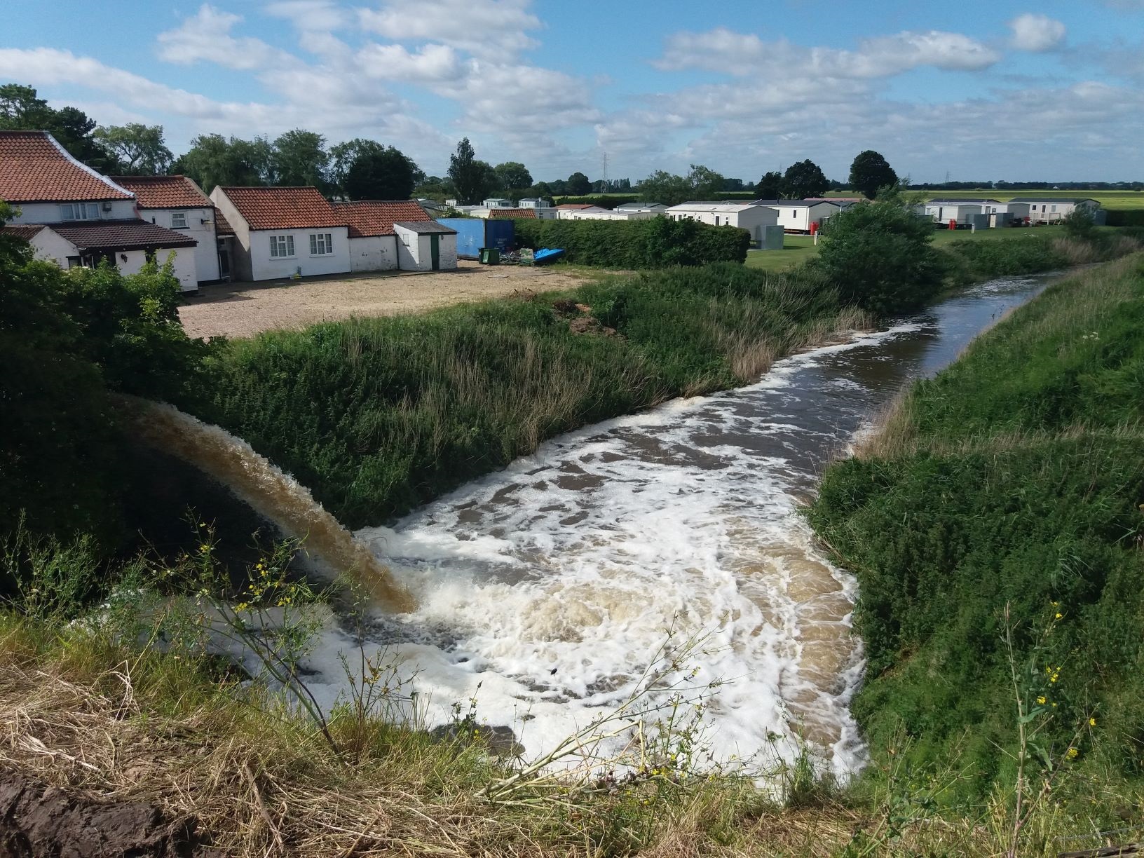 The discharge of water from the Steeping River into the Bellwater Drain.