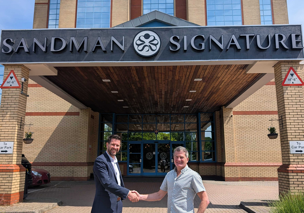 An image of Gints Skieris (left) and Steve Harding (right) shaking hands outside Sandman Signature London Gatwick Hotel