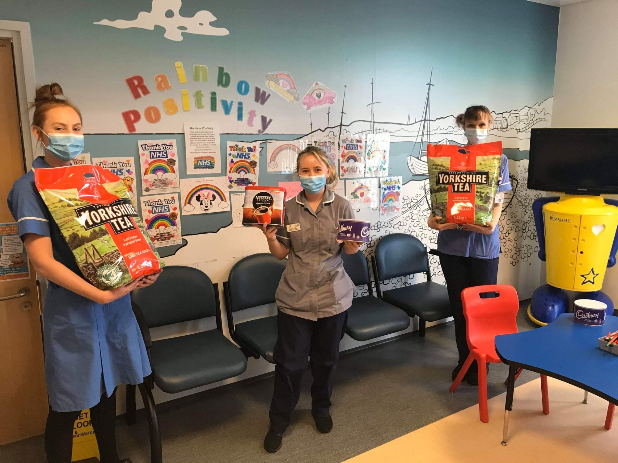 Staff at The Norfolk & Norwich Hospital children's ward with their delivery from NHS Superheroes