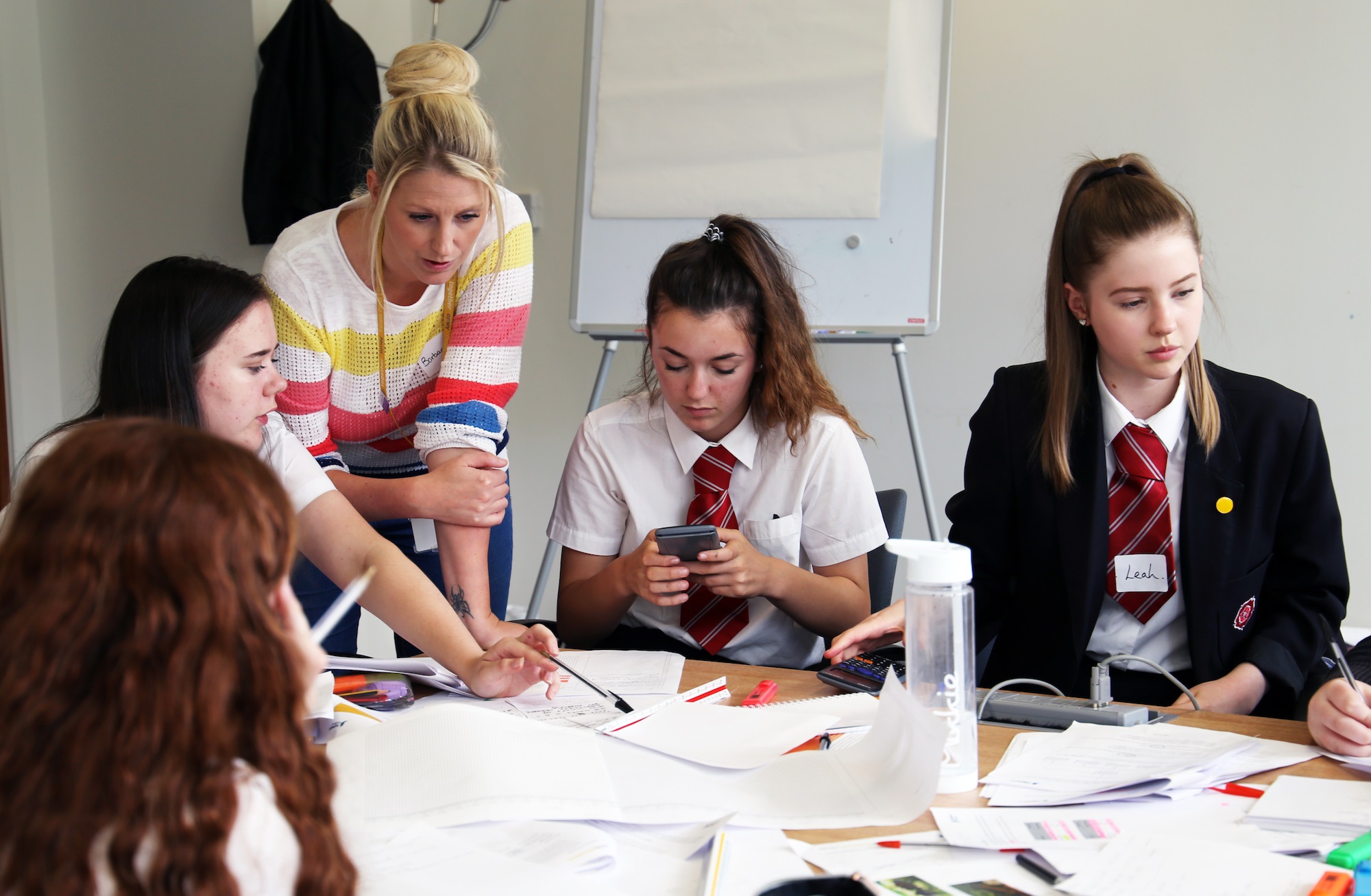 The team from Maidenhill school in Gloucestershire work on their costs with Barbara Silcock, Performance Analyst for Amey