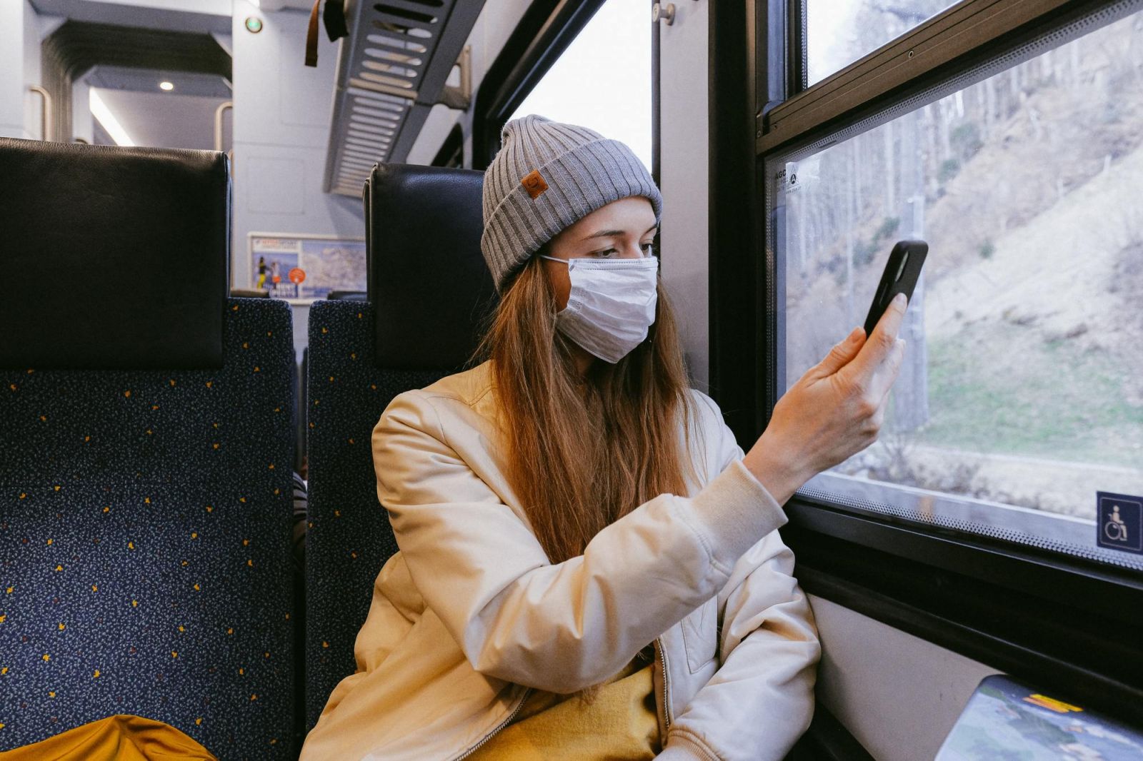 Girl on train with mask